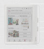 A Kobo Libra Colour eReader set on a background showing faint type, with its screen showing books with colourful covers in the Kobo Store.